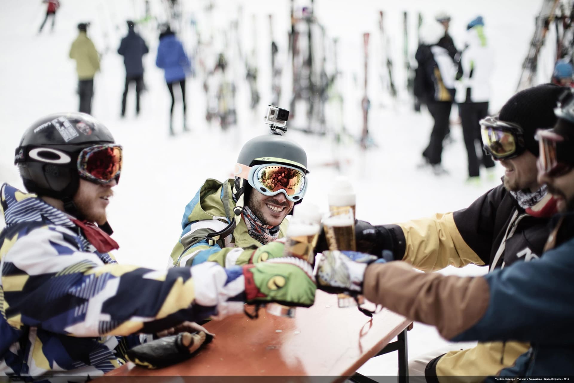 Skiers taking a break for a beer in Italian Ski Resort